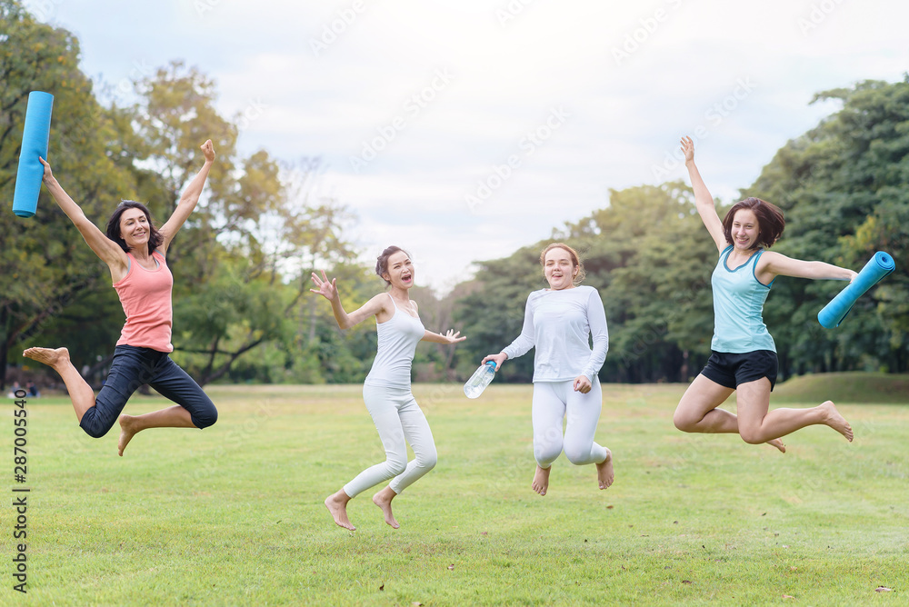 Group of woman prepare to yoga exercise outdoor on a bright morning in the park. Group of woman prepare to yoga exercise outdoor on a bright morning in the park.