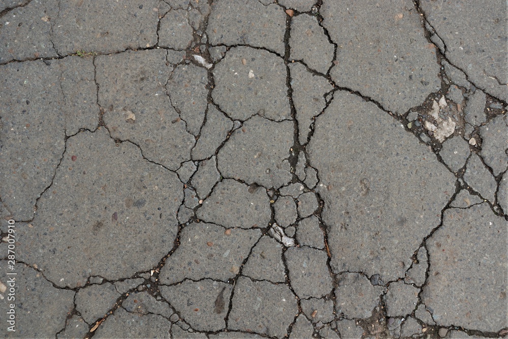 Obraz premium many cracks on the pavement