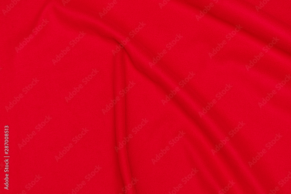 Red crumpled blanket, texture, top view Red crumpled blanket, texture, top view