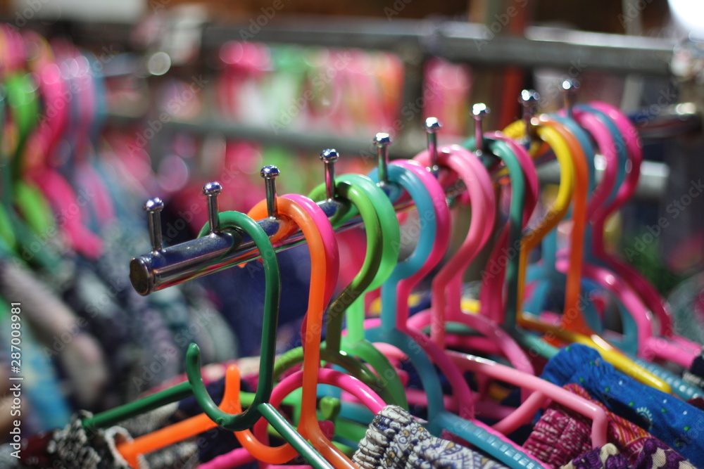 Plastic hanger. Plastic hanger for clothes at​ the​ local​ night​ market.
