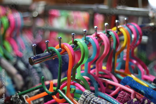 Plastic hanger. Plastic hanger for clothes at​ the​ local​ night​ market.