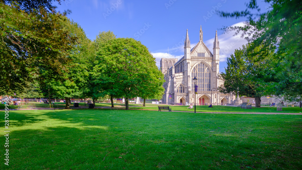 Autumn afternoon light on the West Front of Winchester Cathedral, UK