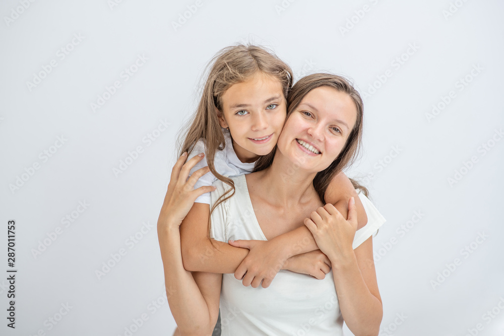 Happy family at home. Mother and daughter have fun at home. Empty space for text Happy family at home. Mother and daughter have fun at home. Empty space for text