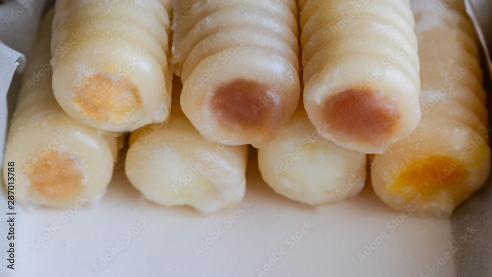 Huesos de Santo or Bones of the Saints, the most traditional of Spanish mazapan sweets, that eat on All Saints Day or Dia de todos los Santos.Close up Huesos de Santo or Bones of the Saints, the most traditional of Spanish mazapan sweets, that eat on All Saints Day or Dia de todos los Santos.Close up