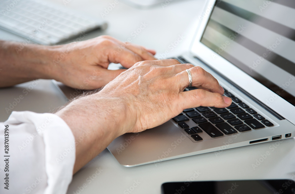Closeup of businessman's hands working with laptop Closeup of businessman's hands working with laptop