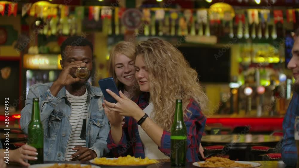 Group Of Happy Multiracial Friends Making A Toast With Beer At Bar Or Pub Group Of Happy Multiracial Friends Making A Toast With Beer At Bar Or Pub