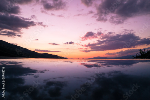 Sky with reflections on the ground. Colorful landscape photo with high dynamic range.