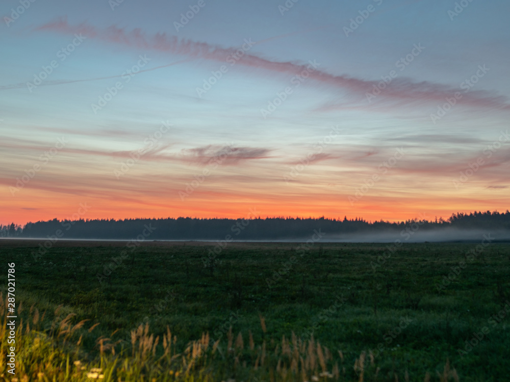 sunrise panorama with fog and red sky