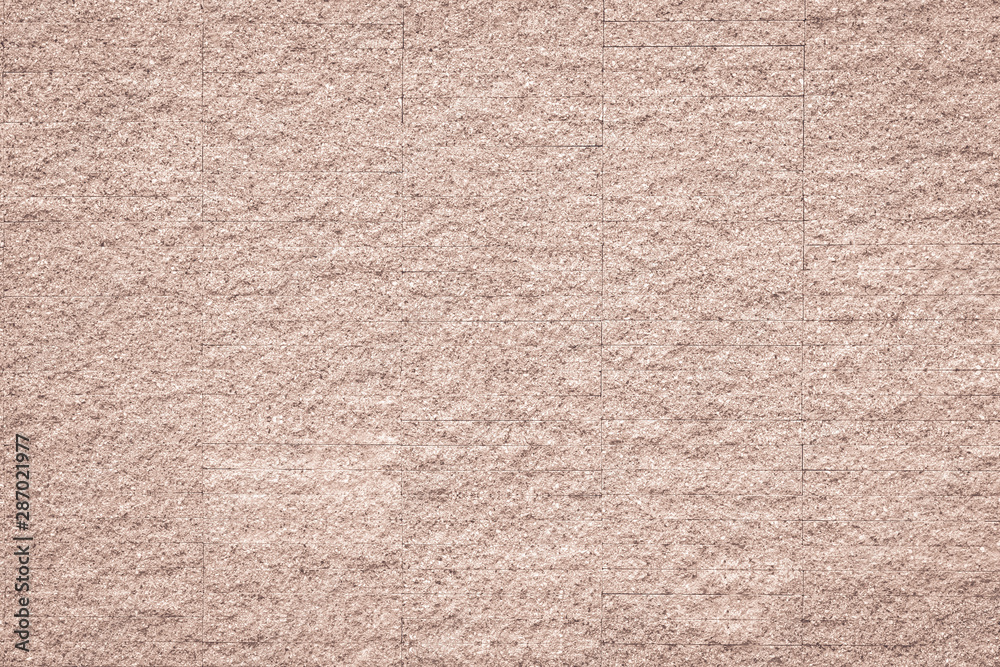 Rustic grunge granite tiled wall detailed pattern texture in natural light red brown Rustic grunge granite tiled wall detailed pattern texture in natural light red brown