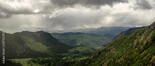panorama of mountains with a forest in the Altai region in the last rays of the sun, Russia © 7ynp100