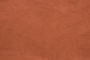 Full frame image of textured stucco in bright terracotta color. High resolution texture of plaster for 3d models, background, pattern, poster, collage, gift wrap, wallpaper etc.