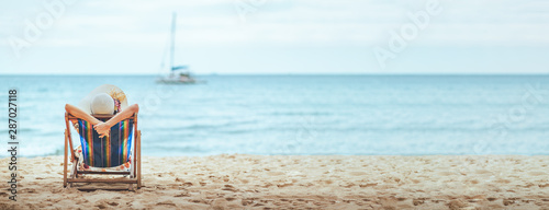 Woman on beach in summer © Peera