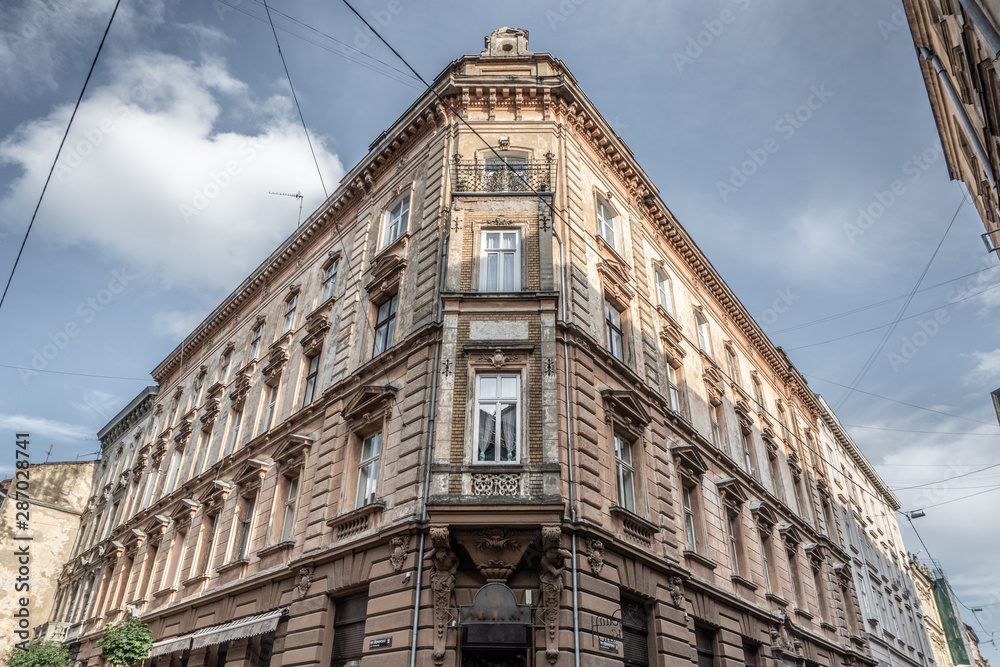 Lviv, Ukraine - Summer 2019: Corner of a 19th century ancient house in a European city.