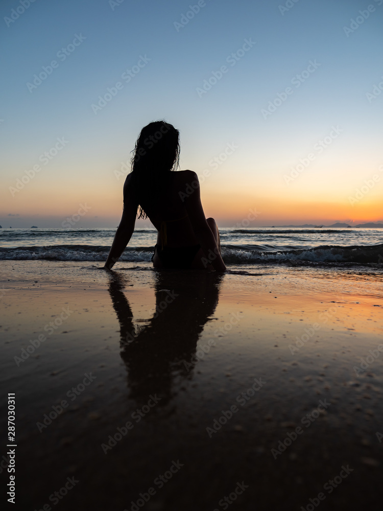 Fototapeta premium woman sunbathing on the tropical beach