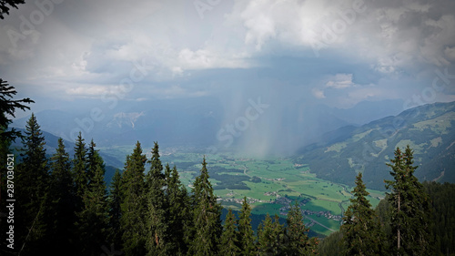 a storm with rain and hail is coming in the mountains