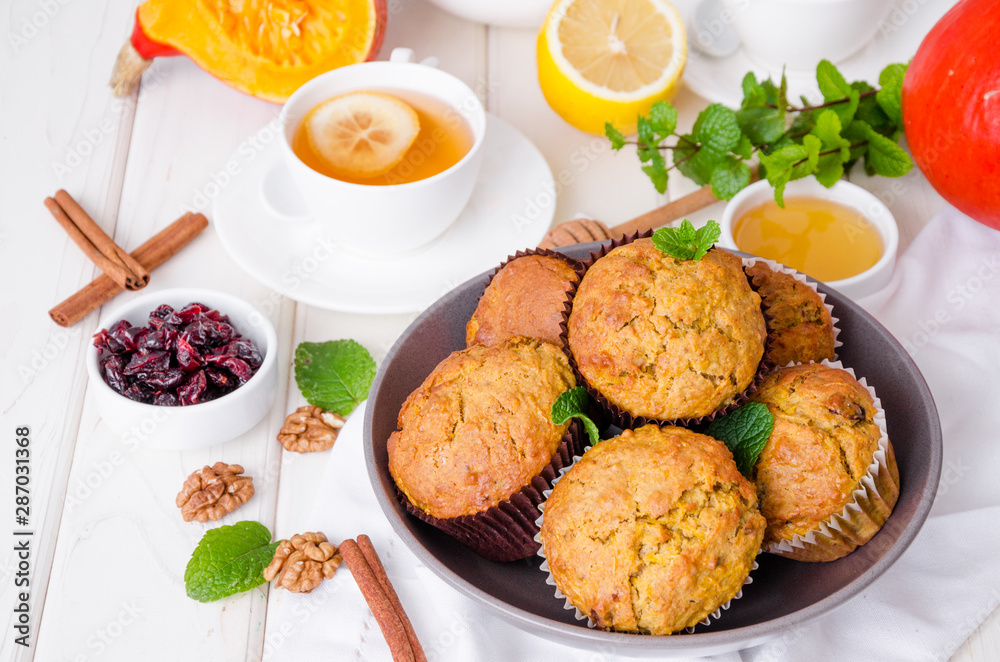 spiced pumpkin muffins with walnuts and cranberries