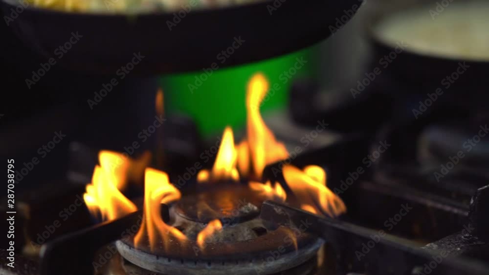 Spaghetti noodles cooking over a gas burner Spaghetti noodles cooking over a gas burner