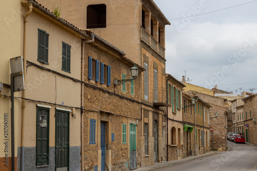 Street with typical houses in the city of Arta at the east coast of balearic island Mallorca, Spain