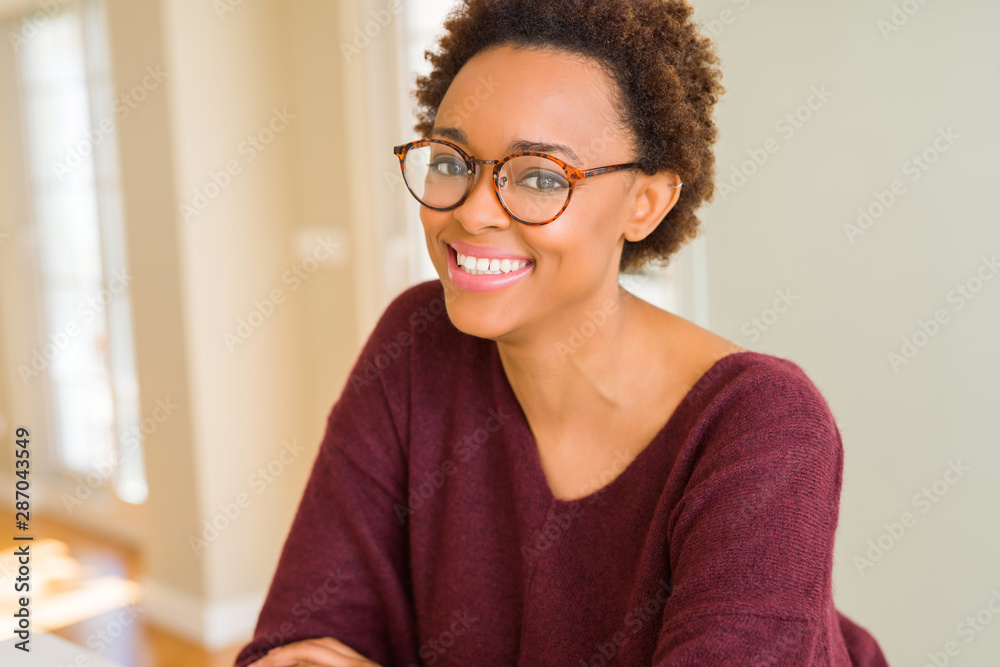 Beautiful young african woman with afro hair wearing glasses Beautiful young african woman with afro hair wearing glasses