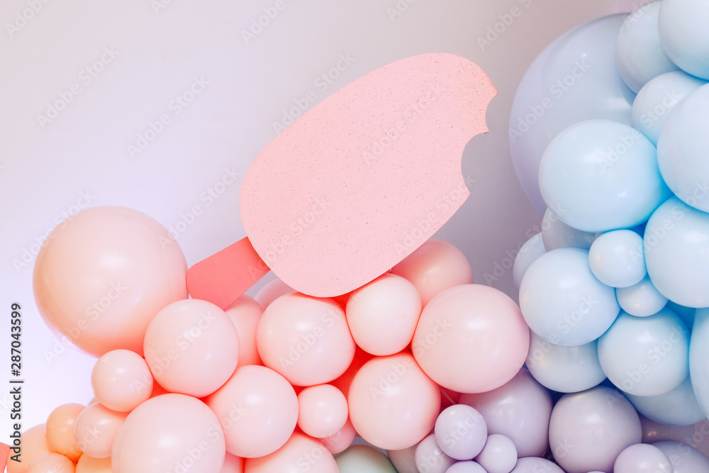 festive place with pink and blue balloons.wall of bright balloons at a children's party.  holiday decorated place for celebrating birthday.bright holiday background wiht balloons with space for text.