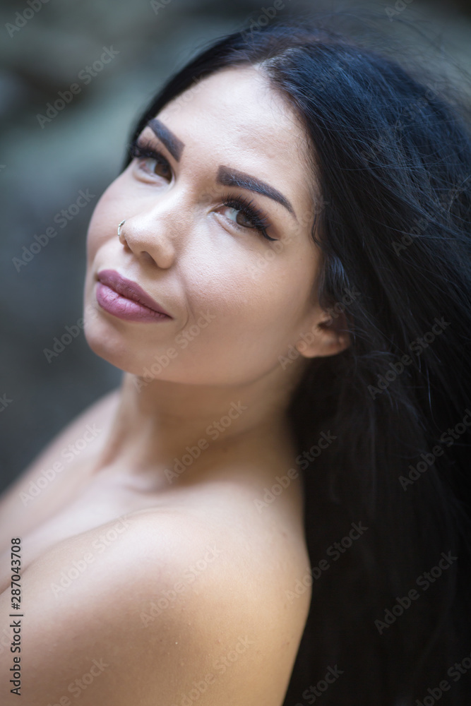 Portrait of dark haired female person outdoors Portrait of dark haired female person outdoors