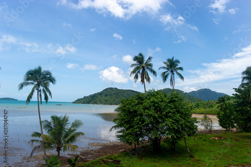 Coconut trees and beautiful sea and clouds full of sky © FOTO SALE