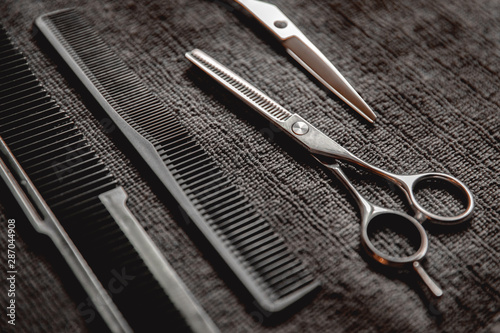 Fototapeta Naklejka Na Ścianę i Meble -  Barbershop background for men beauty salon, hairdresser tools scissors and comb, copy space