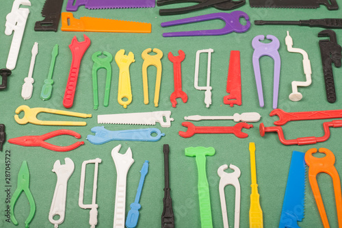 tools plastic toys on a green background