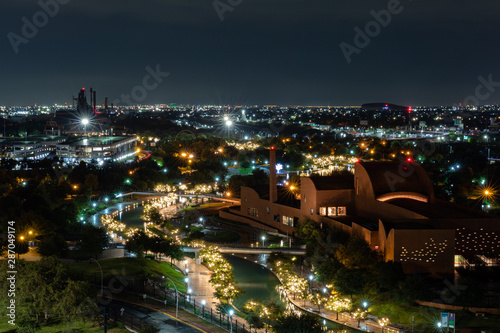 MONTERREY, NUEVO LEON / MEXICO - July 12, 2019: A night shot of the river walk and Mexican Baseball Hall of Fame building next to the river walk in La Fundidora Park in Monterrey.