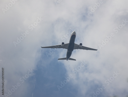 Airplane take off on blue sky with cloudy