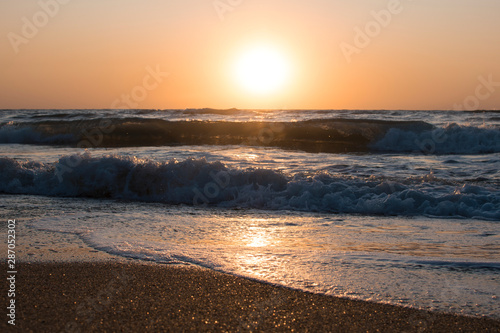 Sunset or dawn on the sea  waves and the sun.