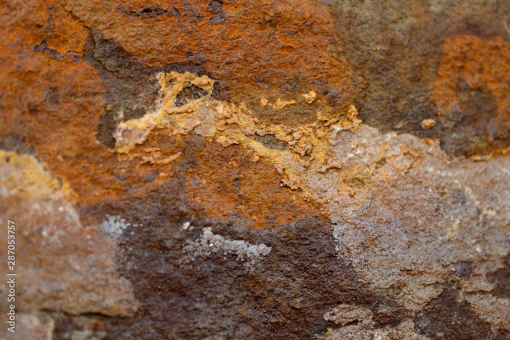 Abstract blurred natural background. Orange with brown rough wall surface. Design concept. Abstract blurred natural background. Orange with brown rough wall surface. Design concept.