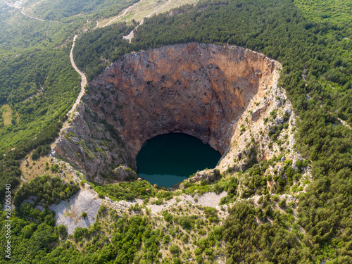 IMOTSKI, CROATIA - August 2019 - Red lake in Imotski, Croatia is a limestone crater, with it's cliffs 200 m high and lake 300 m deep.