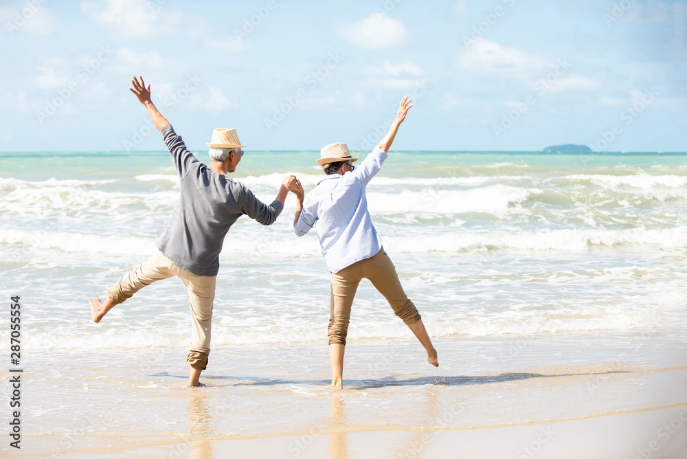 Happy asian senior couple have fun and enjoy at the beach, senior man ...