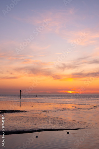 waddenzee or wadd sea during sunset seen from jetty of ameland ferry