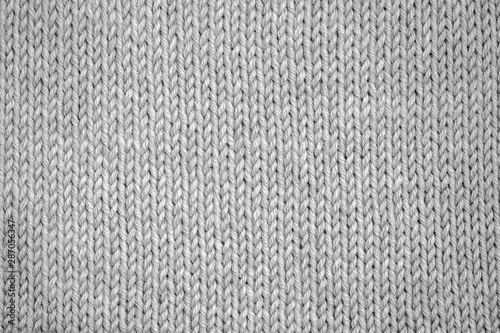 Knitting pattern Knitted seamless background in gray. Knit textures for wallpapers and backgrounds.