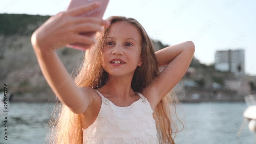 Preteen girl taking selfie photo on smartphone Stock Video