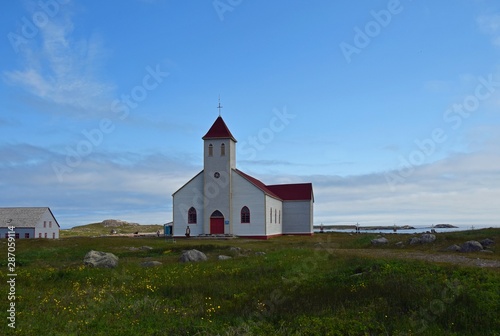 white church with red roof on Ile aux Marin, Saint Pierre and Miquelon
