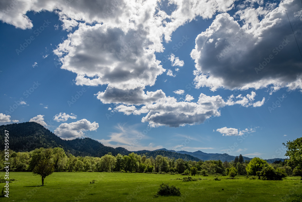 Dramatic clouds and green pasture near Wolf Creek Oregon