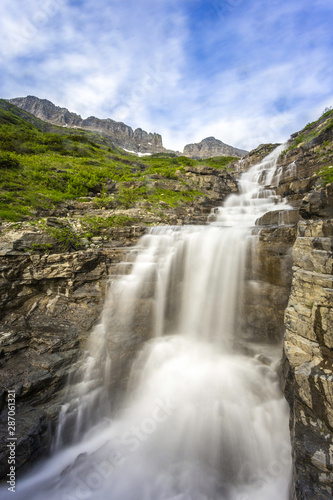 waterfall in the mountains glacier national park