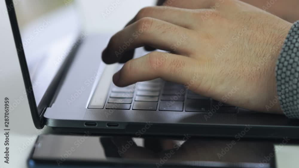 hands typing on computer keyboard, business man working on laptop pc in office hands typing on computer keyboard, business man working on laptop pc in office