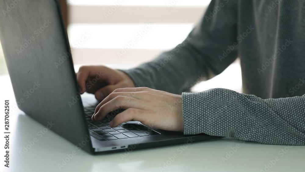hands typing on computer keyboard, business man working on laptop pc in office hands typing on computer keyboard, business man working on laptop pc in office
