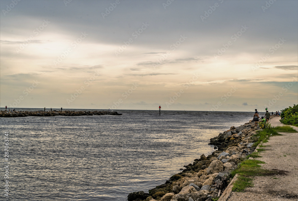 The North Jetty in Venice Florida is a long stone structure that jets out into the Gulf of Mexico The North Jetty in Venice Florida is a long stone structure that jets out into the Gulf of Mexico