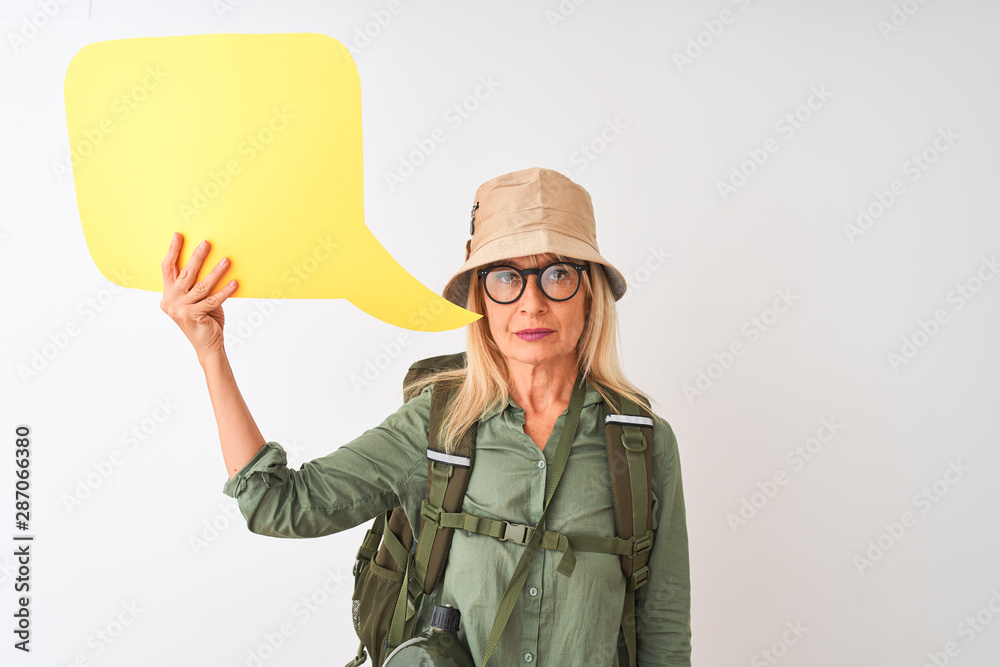 Senior hiker woman wearing canteen holding speech bubble over isolated white background with a confident expression on smart face thinking serious Senior hiker woman wearing canteen holding speech bubble over isolated white background with a confident expression on smart face thinking serious