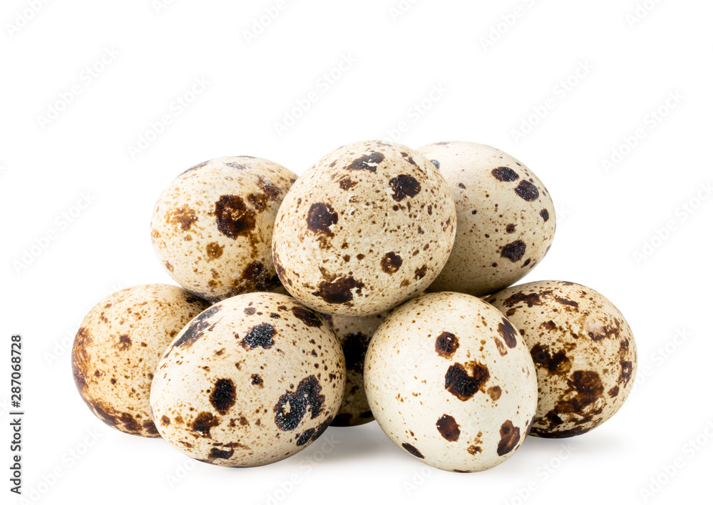Pile of quail eggs on a white, isolated.