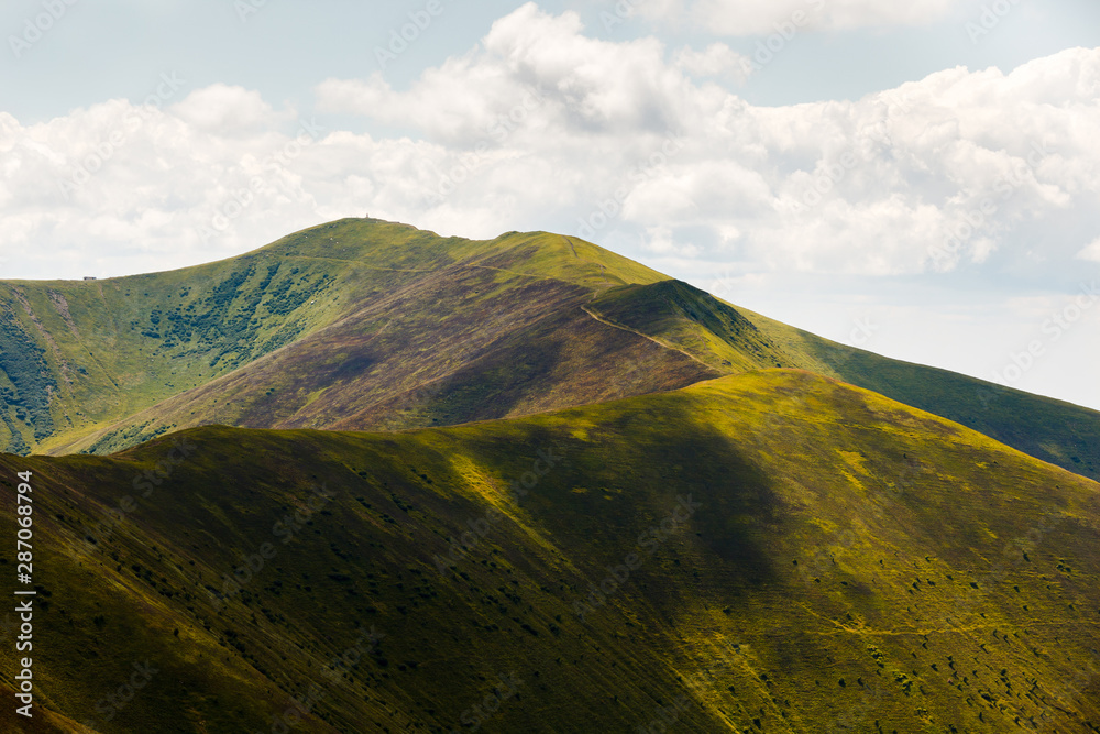Beautiful summer landscape of Borzhava ridge rolling in the distance.