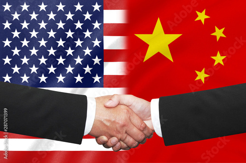 Photography flags of half usa with half china  with business handshake