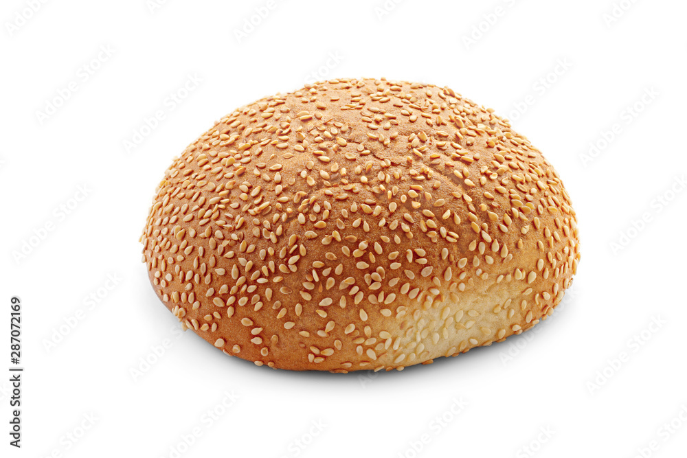 Side view of a delicious ruddy baked bun with sesame seeds with a golden crust isolated on a white background Side view of a delicious ruddy baked bun with sesame seeds with a golden crust isolated on a white background