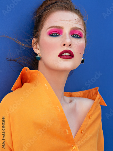 Fashion portrait of red haired woman.