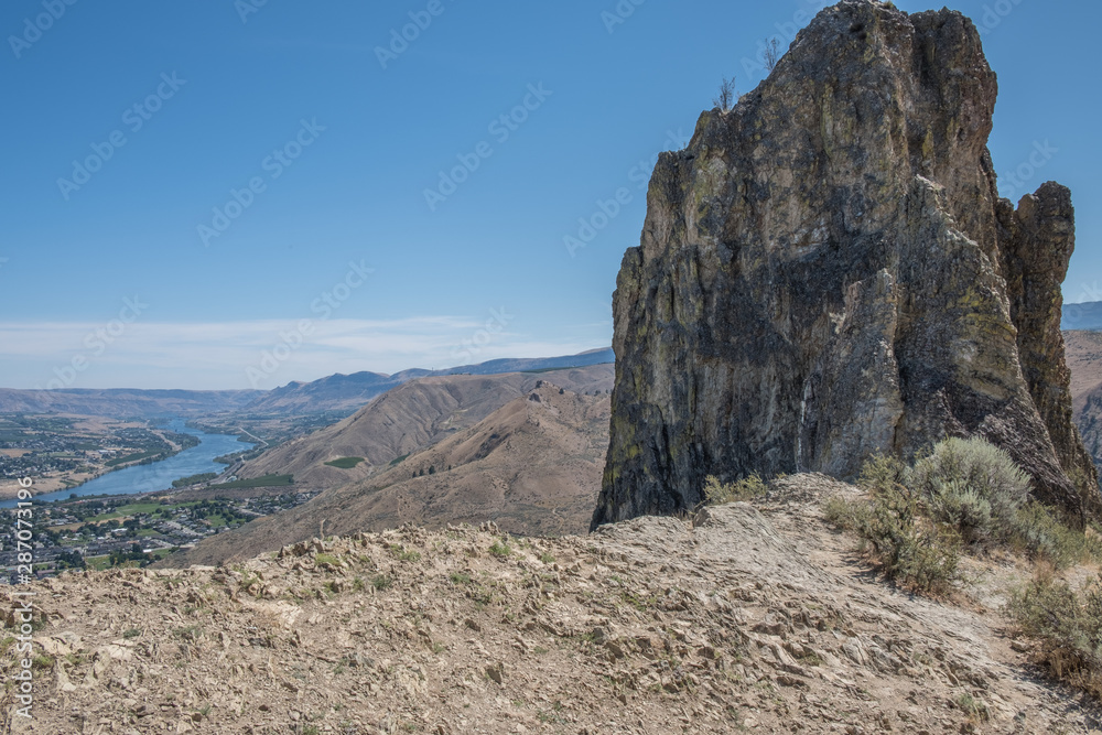 Looking toward Malaga and South Wenatchee from Saddle Rock trail with rock formation in foreground